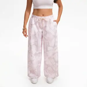 APUYO Women's Pink Camouflage Pants — Mid-to-Low Rise, Loose-Fit Casual Sweatpants. Features soft fabric and an elastic waistband; suitable for both fitness activities and everyday wear. catch print pants