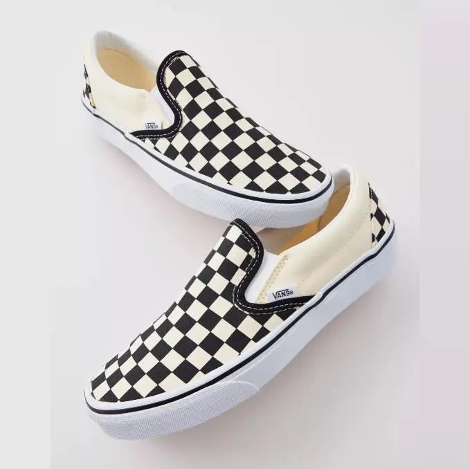 Vans Classic Slip-On Checkerboard Shoes.