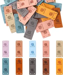 50 Pcs Leather Handmade Labels,PU Leather Tags for Crochet Accessories Folding Handmade Tags Knit Accessories with Holes Embossed Tag Embellishment Knit DIY Apparel Supplies for Jeans Bag Shoes Hat