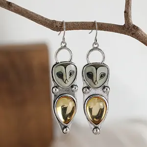 1 pair of Bohemian retro owl pendant earrings and personalized women's earrings with synthetic gemstone inlay