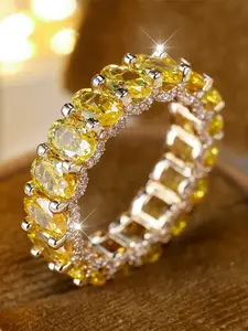 An oval-shaped ring made of synthetic yellow zirconia is fashionable and retro, suitable for women to wear at travel parties, Artificial Zircon Rings