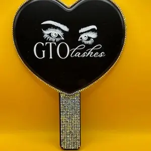 GTO Lashes Bling Handheld Heart Mirror with Black Background and Eye Design