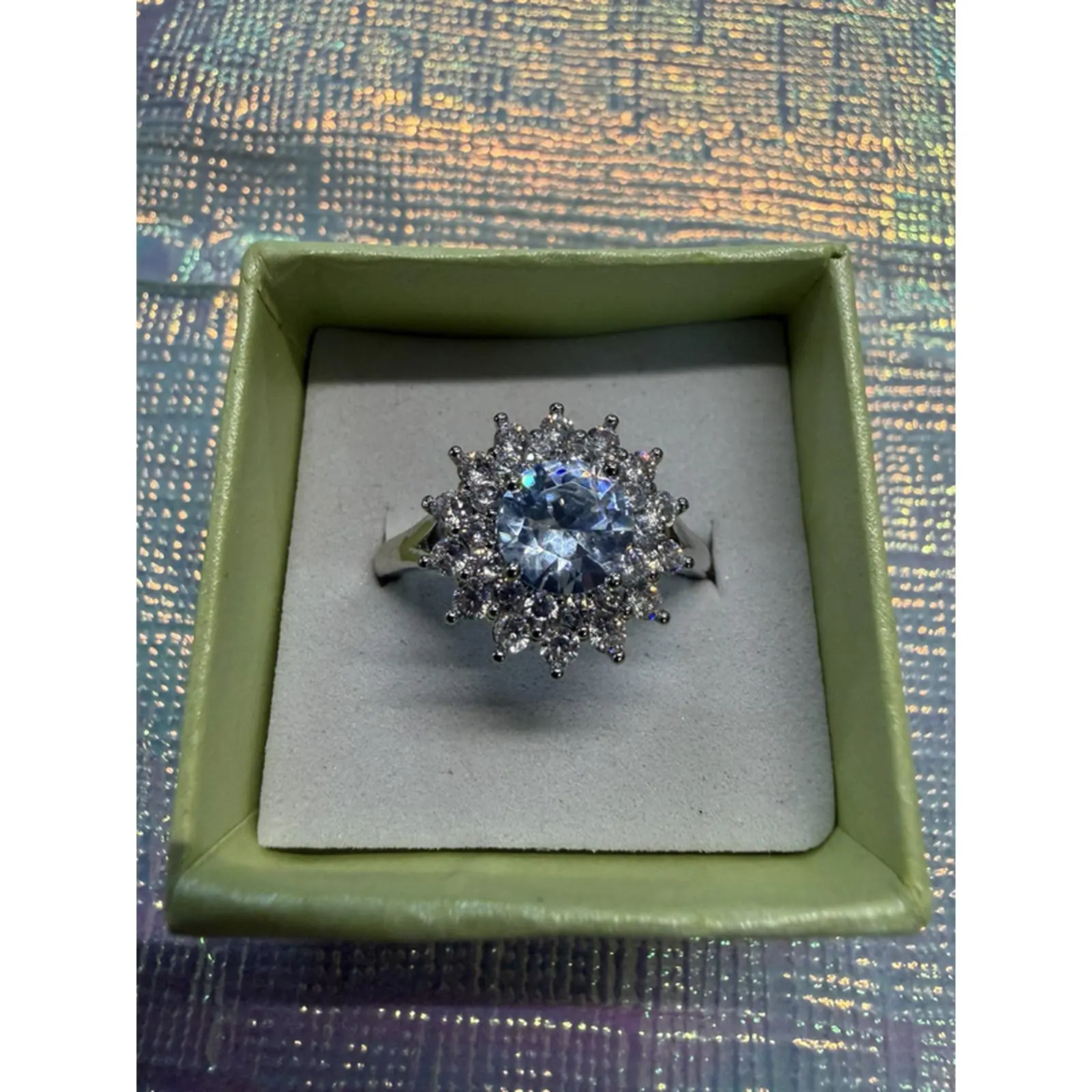 Sterling Silver Snowflake Ring with Sparkling Blue Center Stone and Delicate Design