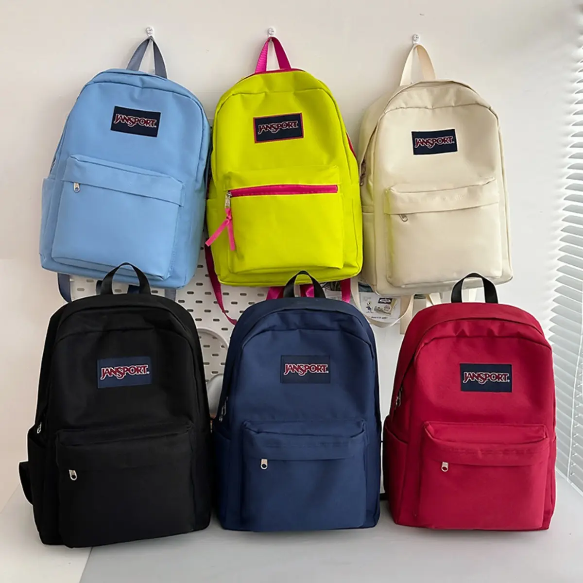 JanSport's new casual backpack for men and women - simple, large-capacity, lightweight school and travel bag for students