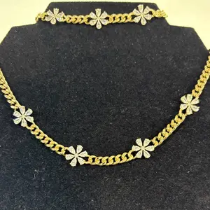 Gold Laminated Chain with Flower Accents for Stylish Outfits