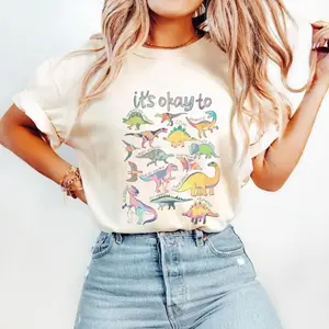 Comfort Colors It’S Ok To Be Different Autism Dinosaur T Shirt, Autism Awareness Shirt, Autism Mom Tee, Special Education Teacher Shirt, Gift For Teacher