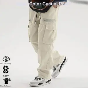 Men's loose fitting solid color cargo pants with drawstring waist and drawstring pockets. These casual and comfortable zip up cargo pants feature multiple pockets suitable for everyday outdoor wear and are suitable for all seasons, making them a great cho