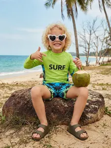 New summer 2-piece swimwear set for boys, featuring a long-sleeve top and shorts. UV-protective and water-resistant, perfect for beach vacations All Season Wear