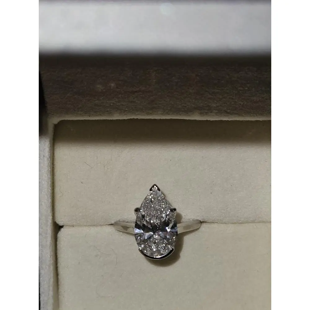 4.03ct G Color VS1 Clarity Pear Brilliant Diamond Ring in 14k White Gold with Cathedral Setting and Hidden Pave on Bridge