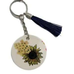 Sunflower Keychain with Navy Blue Tassel - Circular Design Featuring a Sunflower Motif