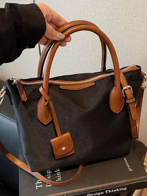 Minimalist classic color-block shoulder/crossbody bag with two top handles and adjustable shoulder straps; a casual commuter handbag with a retro British “dumpling” design; a nylon water-resistant everyday tote; Everyday Shoulder Bag; niche style suitable