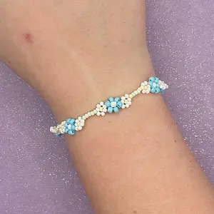 Beaded Flower Bracelet. Handmade with white and blue flowers