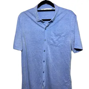 Travis Mathew Blue Button-Up Shirt with Pocket and Collar Design for Men