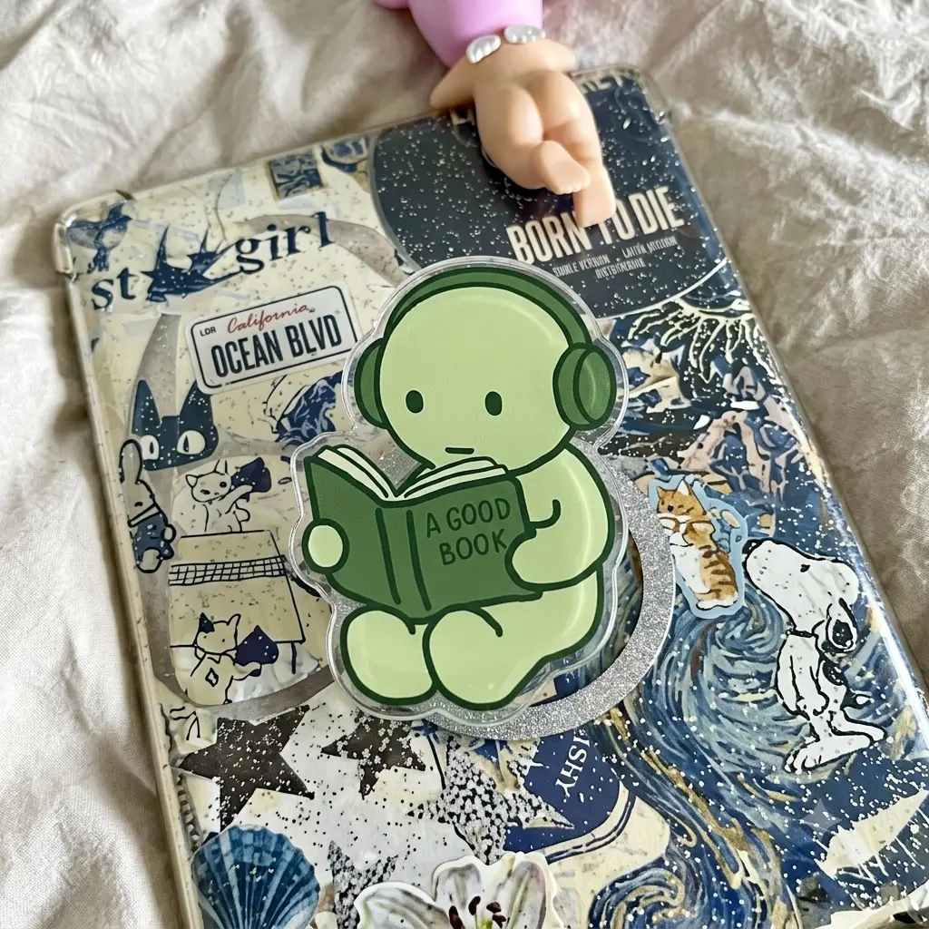 Cute Green Figurine Reading A Good Book Phone Grip Headphones Griptok Aesthetic Bookworm Gift Trendy Coquette Kindle Holder Acrylic Tech Stand Accessory