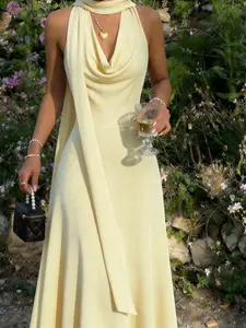 Vory Velvet Fabric Dress, Halter Neckline, Draped Cowl Front, Sleeveless Design, Fitted Waist, Flowing A-Line Skirt, Soft Texture, Luxurious Finish, Smooth Surface, Lightweight Material, Elegant Drape, Breathable Fabric, Feminine Silhouette, Classic Style