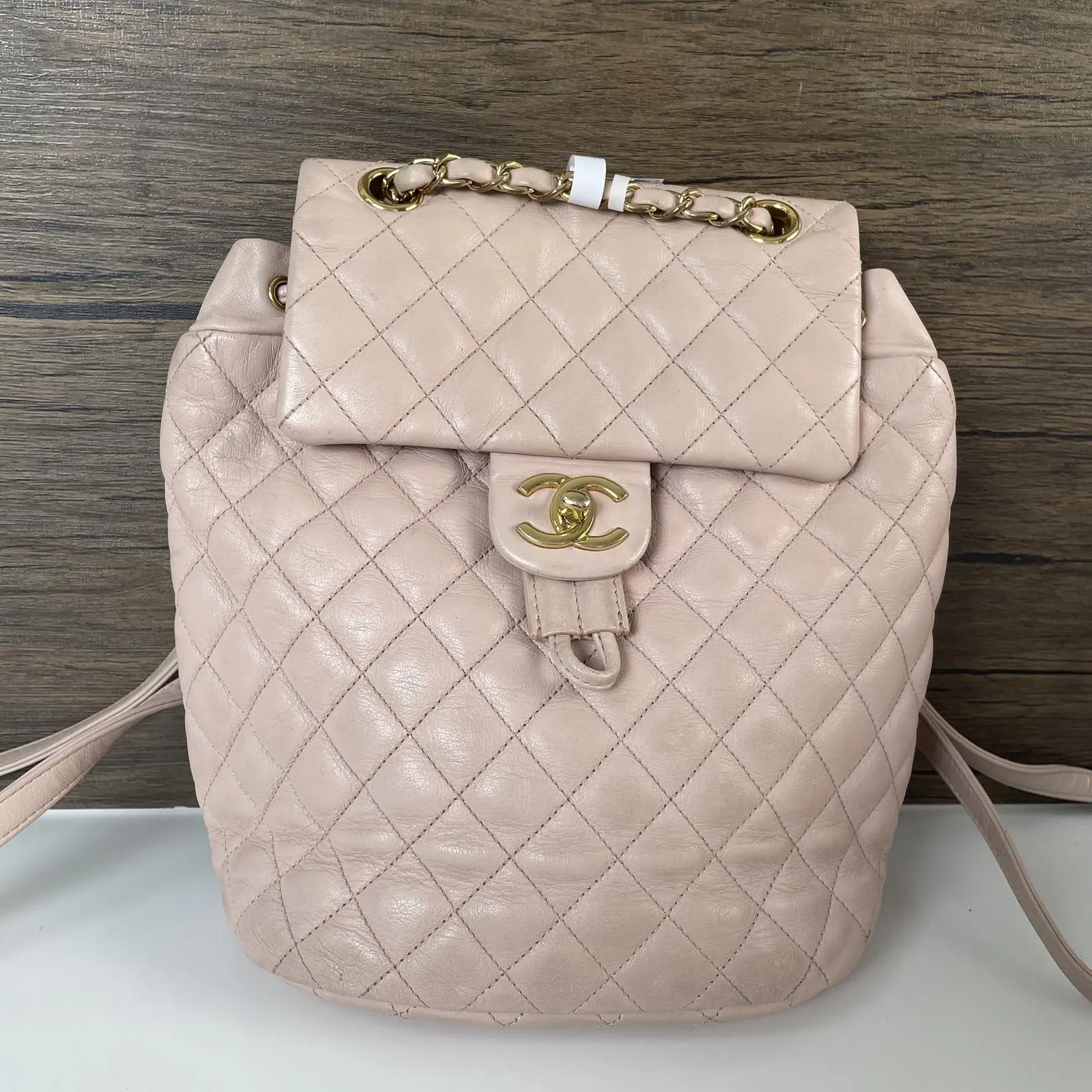 Pre-owned CHANEL leather Backpacks Vintage Light Pink Lambskin Quilted Drawstring Bucket Backpack with Gold Hardware++bag charm++