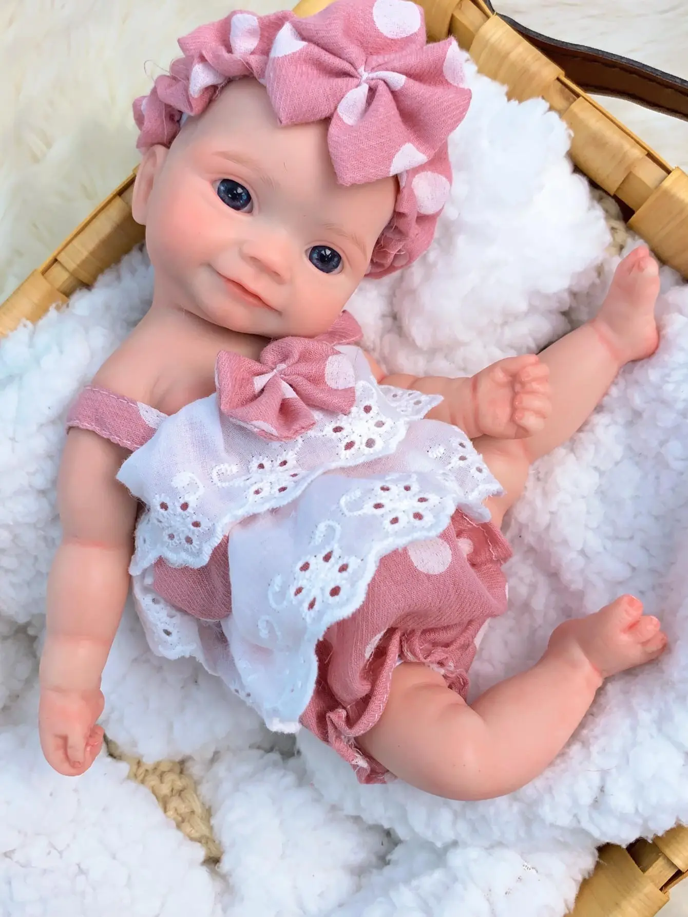 Reborn Baby Doll 10 Inch Full Body Soft Silicone CuteReborn Girl Doll with Pink Polka Dot Outfit LifelikeNewborn Baby Doll with Birth Certificate and AccessoriesPerfect Christmas Gift and Birthday Present for ChildrenAged 3 and Up