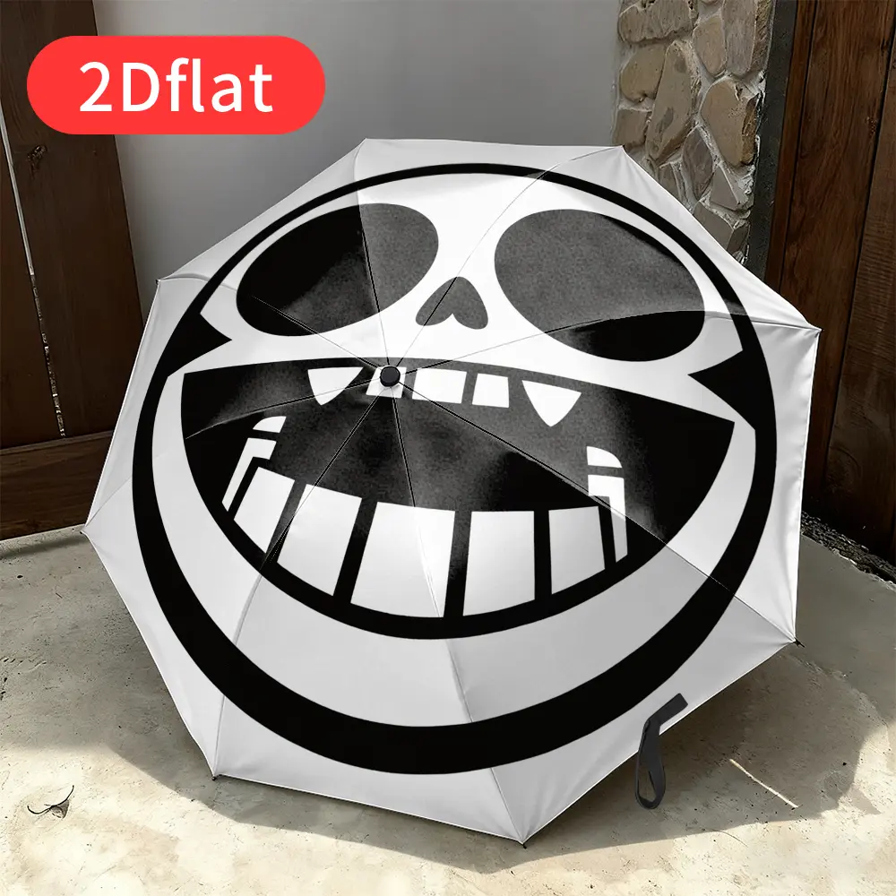 Foldable Umbrella: This compact umbrella features a bold black-and-white cartoon skull design with exaggerated eye sockets, a wide grin, and prominent teeth. Perfect for travel, backpacking, and as a festive gift.