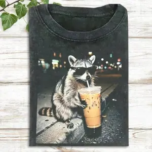 Women's Short-Sleeve Raccoon Iced Coffee Graphic T-Shirt - Streetwear Breathable Fit Top, Made in USA, Casual Outfits, Cute Wildlife Gift for Coffee Lovers