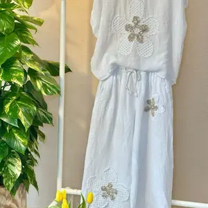 Zafira Linen Set with V-Neck Top and Wide-Leg Pants Featuring Sequined Flower Appliqué One Size Fits Small to Large Womenswear Clothes