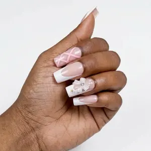Elegant Pink and White Nail Art Design with Floral Accent for Stylish Manicure