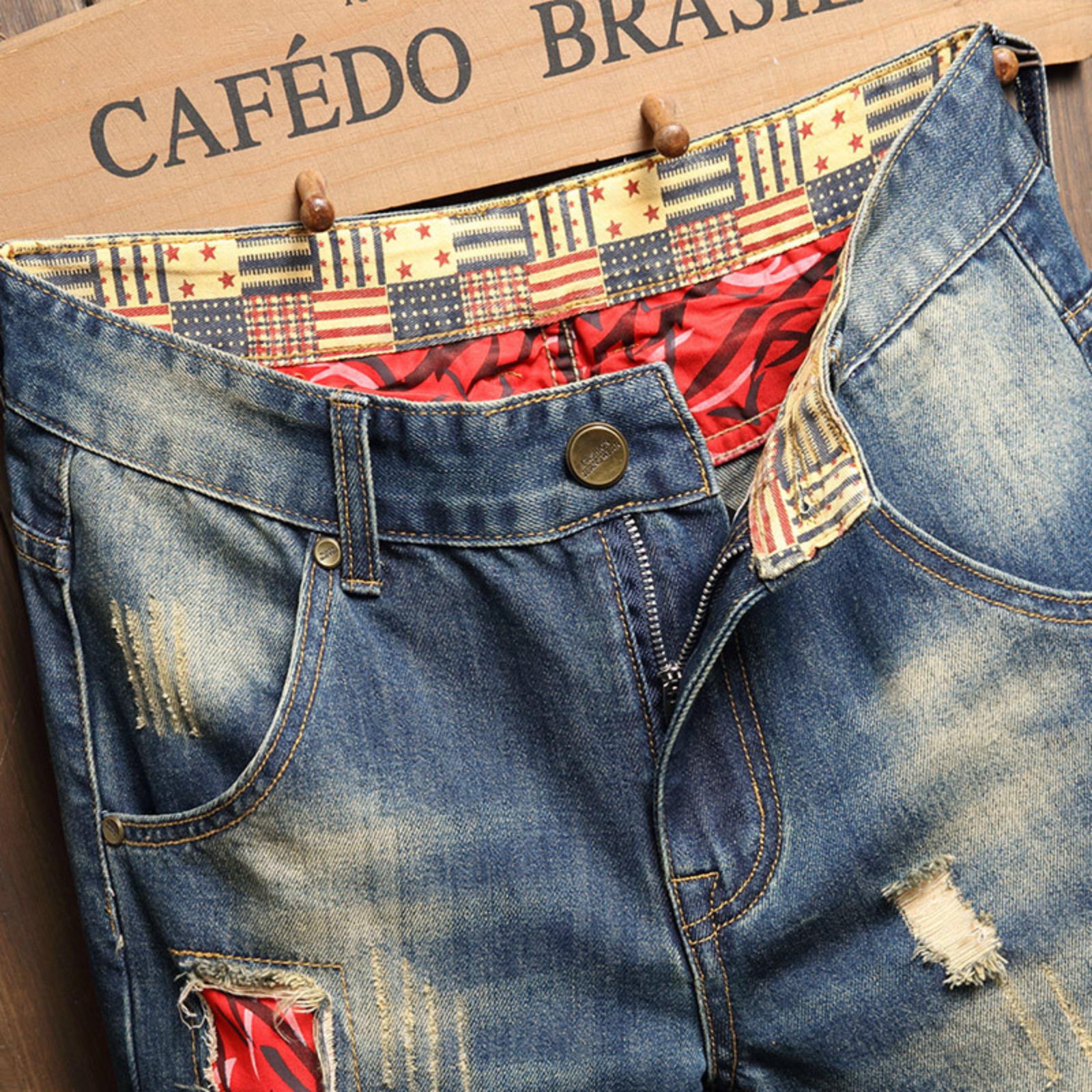 Bleached distressed denim mid-rise shorts with no stretch, multiple rips, raw hem, red-edge print lining—trendy five-inch inseam