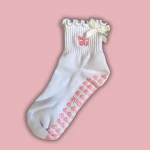 White ruffle grip socks with pink embroidered butterfly and white bow for pilates, barre, yoga or lagree