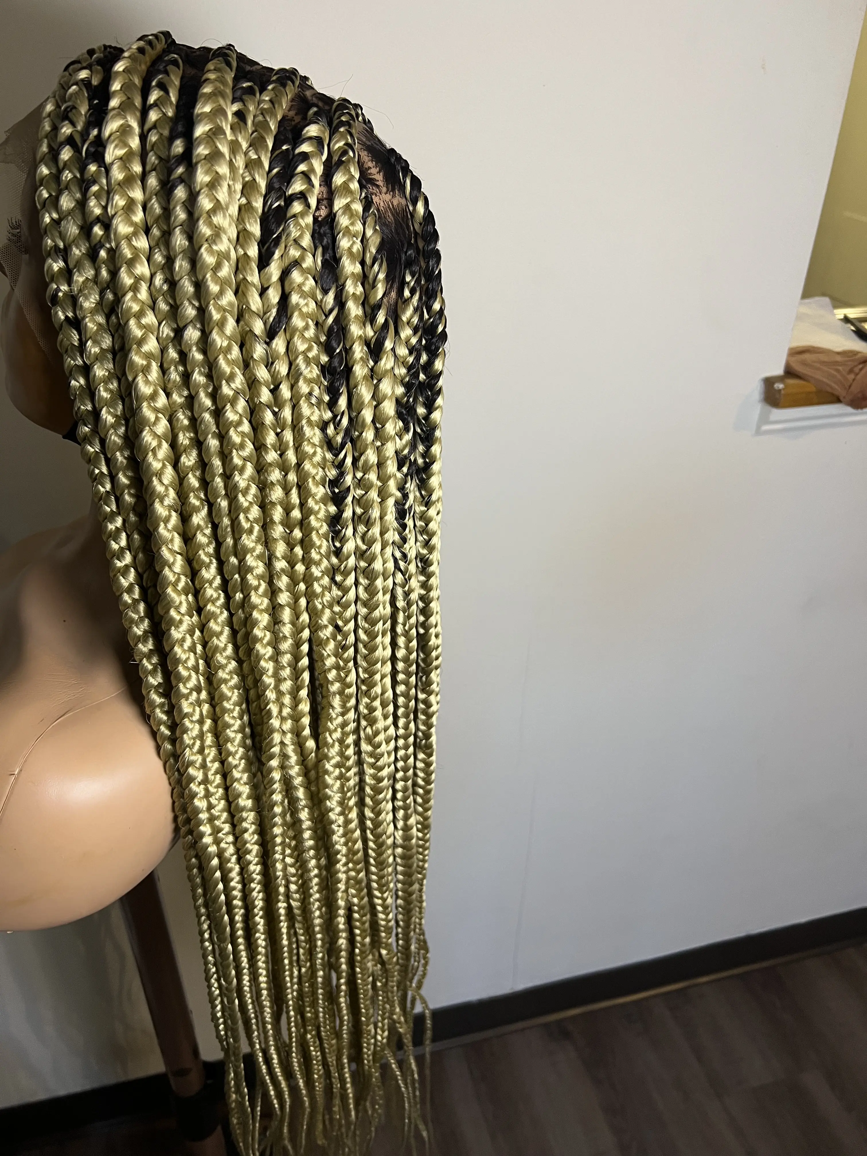 30 inch full lace knotless medium size braids. Blonde color