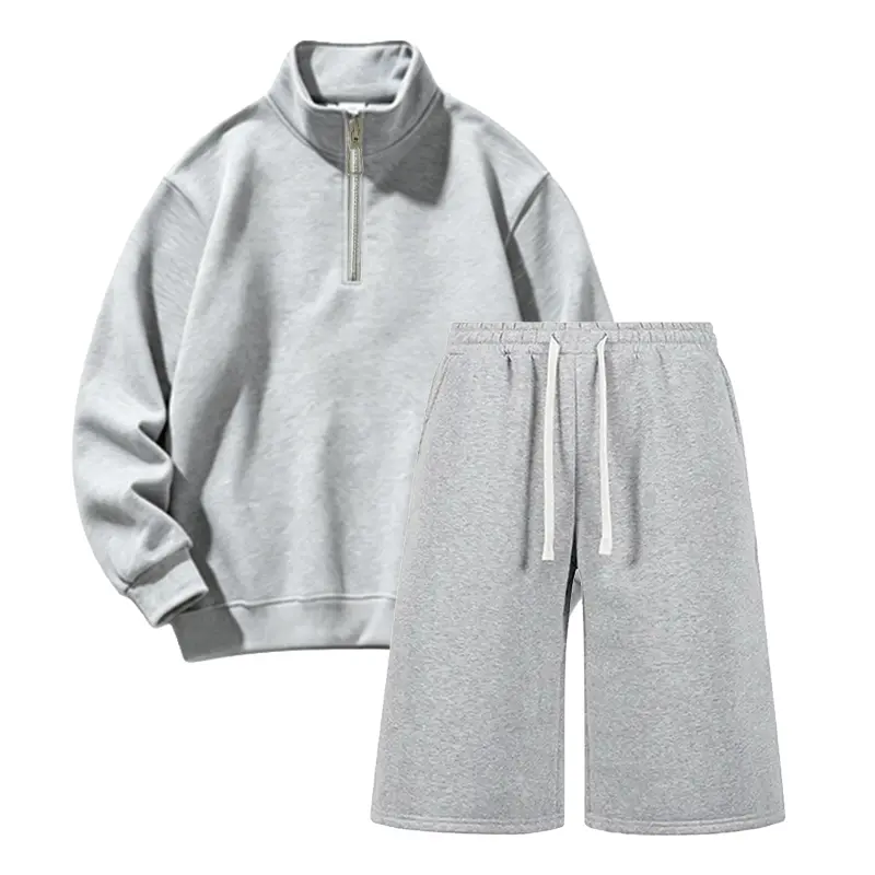 Men’s two-piece athletic set: half-zip stand collar long-sleeve sweatshirt + solid-color loose athletic seven-eighths pants, a warm casual streetwear outfit for everyday wear.