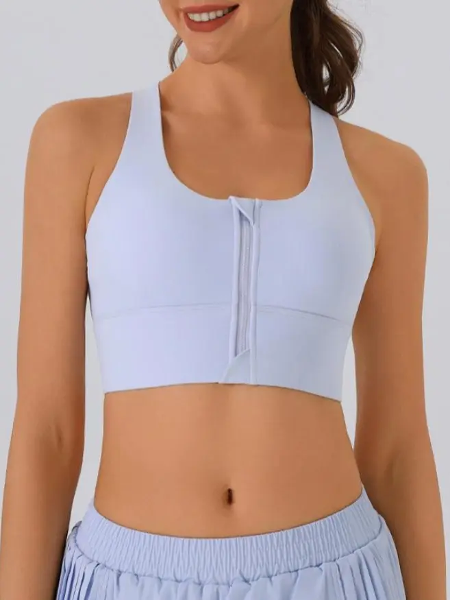 Women’s quick-dry sports bra with a front zipper, featuring a racerback design and shock-absorbing functionality, suitable for fitness, training, yoga, and other athletic activities. The product design features removable chest pads, providing a personaliz