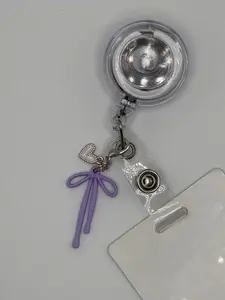 Bow charm for badge reel accessory