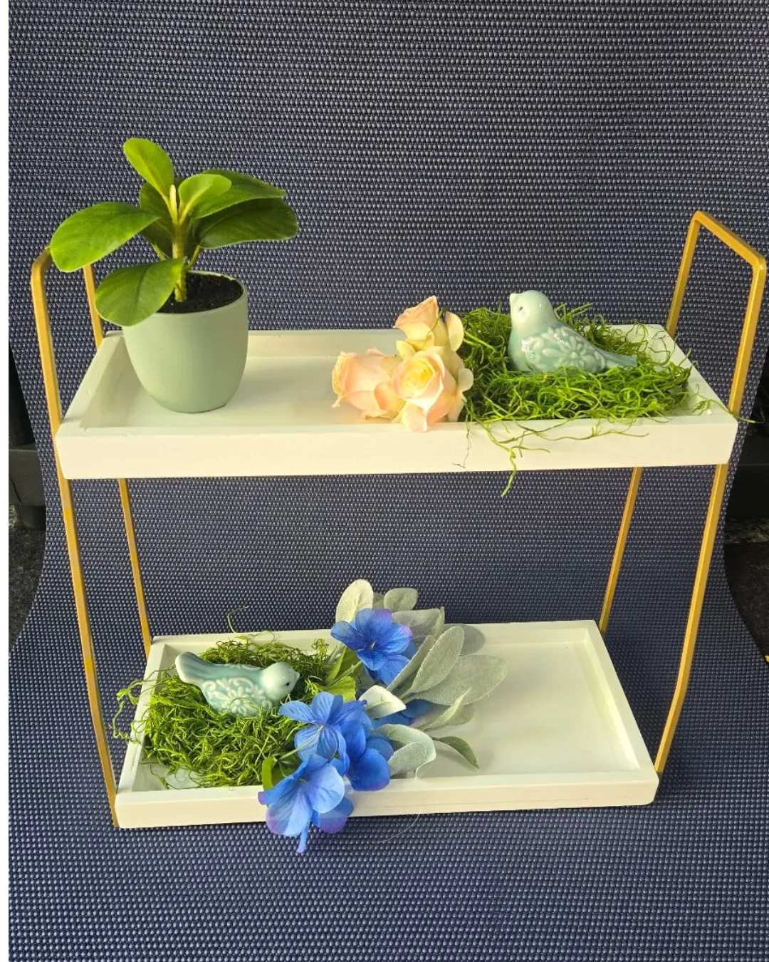 Two-Tiered Spring Display with Plant, Flowers, and Decorative Items on White Shelf