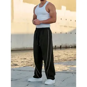"YOUNG" Embroidered Track Pants | Black Streetwear Wide-Leg Bottoms SpringStatements