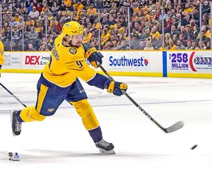 Filip Forsberg Nashville Predators Unsigned Gold Jersey Shooting Photograph