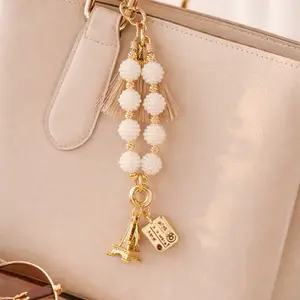 Elegant Travel Keychain – Gold & Pearl Style Charm