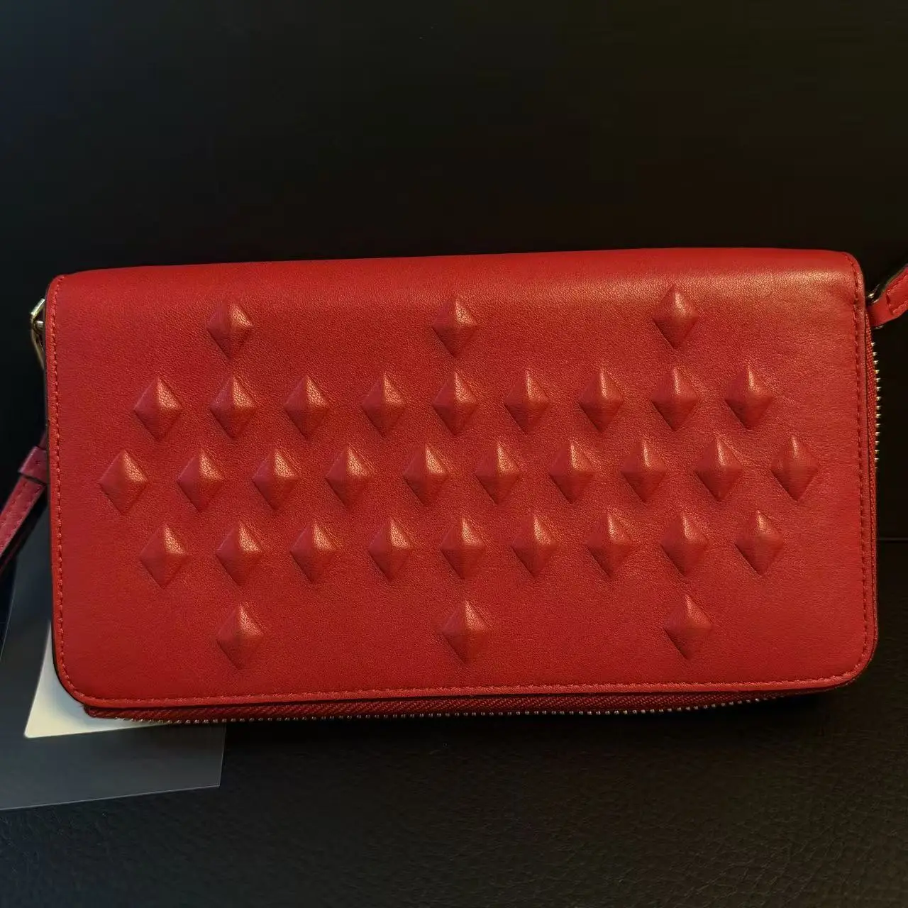 Pre-owned MCM Pre loved red stud embossed long zip wallet SBA