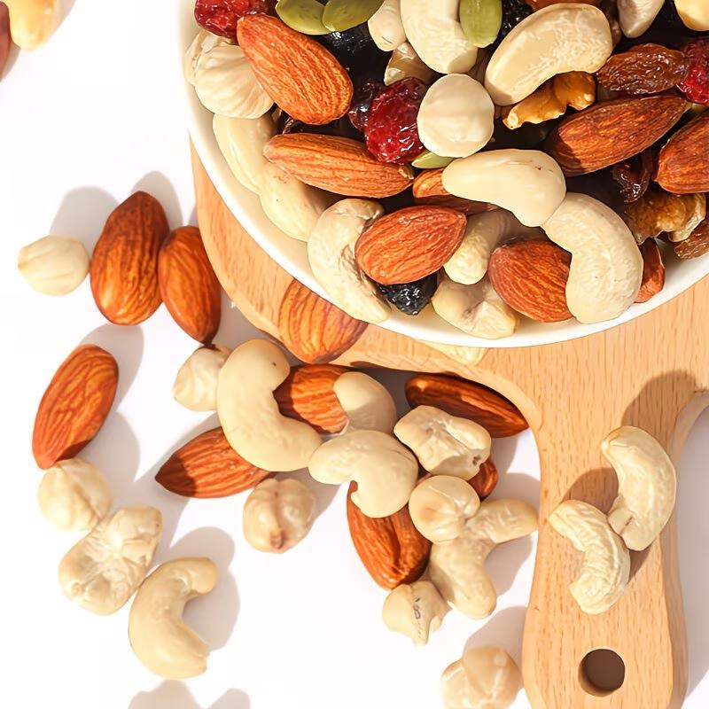 Mixed nut pieces (hazelnut, almond, cashews, walnut, dried grapes, dried cranberries); gluten-free snack; energy boost before and after workouts; low sugar, high protein; crunchy and tasty; individual small packaging for office snacks.