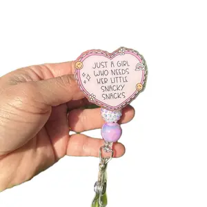 The All Day Nurse Snacky Snacks Badge Reel - Cute Heart Nurse ID Holder with "JUST A GIRL WHO NEEDS HER LITTLE SNACKY SNACKS" Text and Colorful Beads