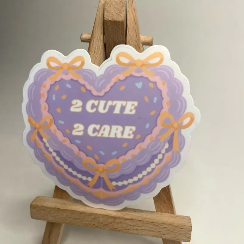 2 CUTE 2 CARE Pastel Vintage Cake Sticker with Heart Design and Orange Bow Accents for Decorative Use