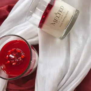 Melted Wild Pomegranate Scented Handcrafted Candle with Rich Red Wax and Pomegranate Seeds for Aromatic Home Decor