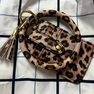 Leopard Printed Wallet Wristlet with Gold Tassel and Secure Snap Closure for Everyday Use