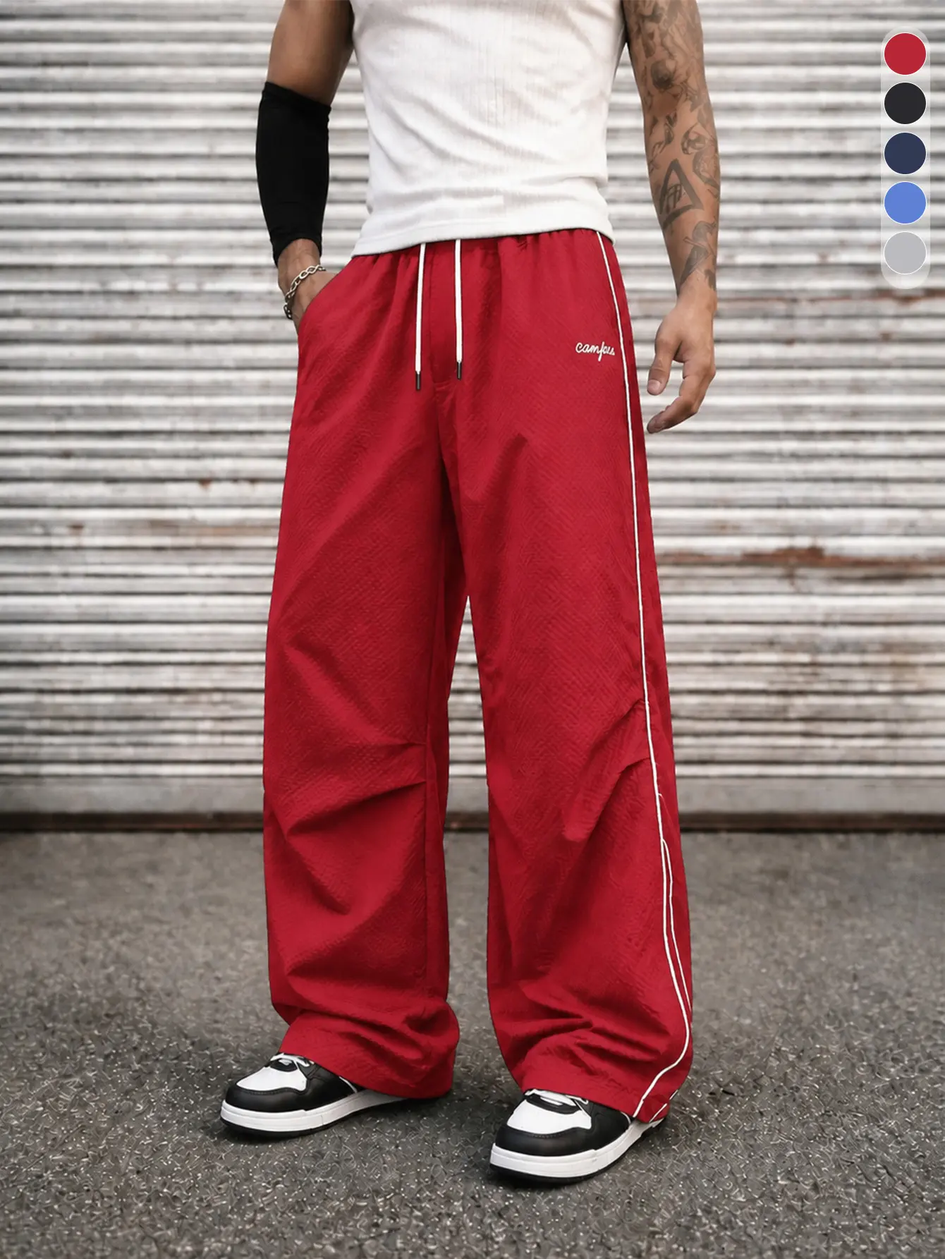 Men’s casual athletic pants, relaxed long sports pants with side stripes, street-style loose pants, suitable for all seasons