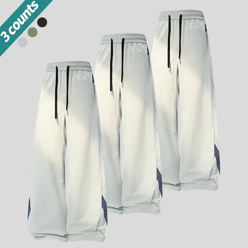 3-pack men’s loose casual pants with an adjustable elastic drawstring waist, suitable for the gym, training, and casual wear. Comfortable stretchy fabric, breathable material, loose fit—an essential for sports enthusiasts.