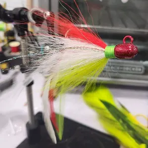 1oz bullet jig custom bucktail, withe feathers and flasha. color green white and red.