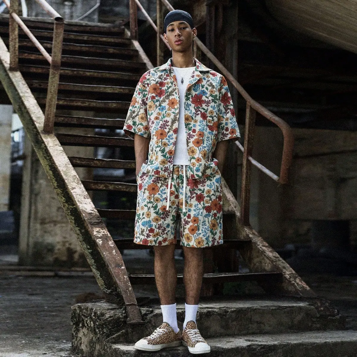 Men’s vintage floral two-piece set featuring a short-sleeve shirt and shorts. Relaxed vacation casual outfit with an all-over floral print that creates a rich summer vibe. Loose fit accommodating various body types. Shirt cuffs are neat and tidy, and the