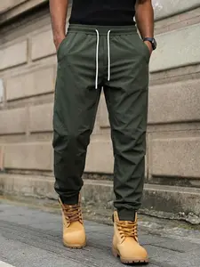 Men’s loose military green jogger pants made from breathable, quick-dry fabric that resists sweat, featuring a clean silhouette—designed for casual streetwear, commuting, weekends, and all-day comfort.