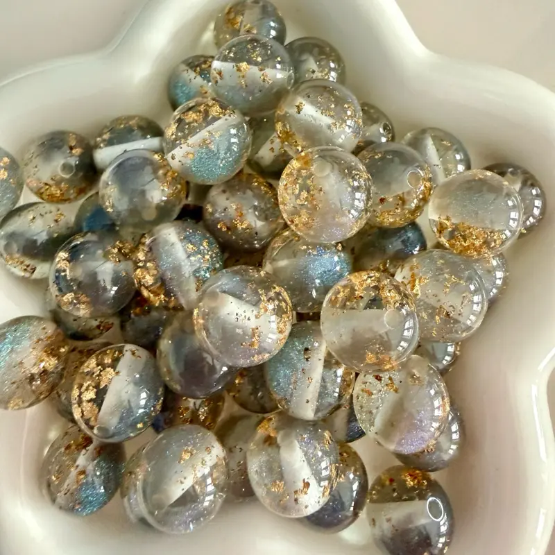 Acrylic 16mm beads with  glitter for craft projects.