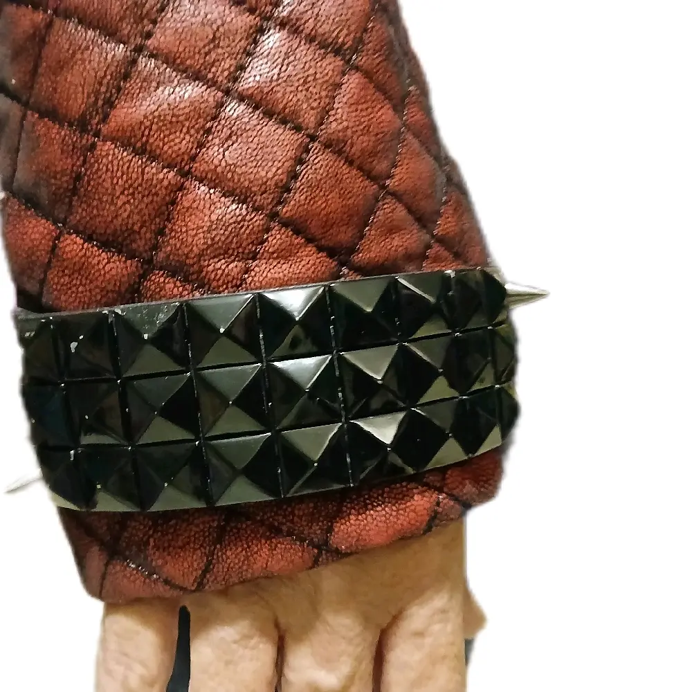 Red Womens Size 7 Battle Jacket with Unique Black Pyramid Detailing on the Sleeve