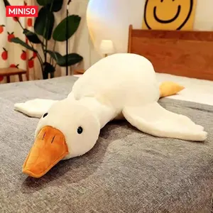 MINISO Cute Big White Goose Plush Pillow Toy! Large and irresistibly huggable, it's a favorite for both kids and adults. Suitable for all beds, offering coziness whether you cuddle or clamp it. A practical and sweet sleep companion.