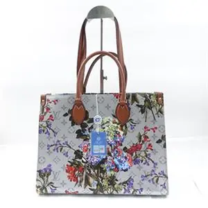 Pre-owned Louis Vuitton leather  Travel Bags Metallic Monogram LV Garden OnTheGo MM Silver